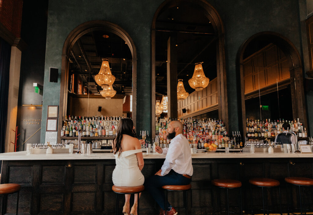 Unique engagement session at a rooftop bar in downtown Denver, Colorado