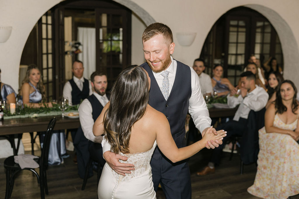 Bride and groom sharing first dance at Colorado wedding reception.