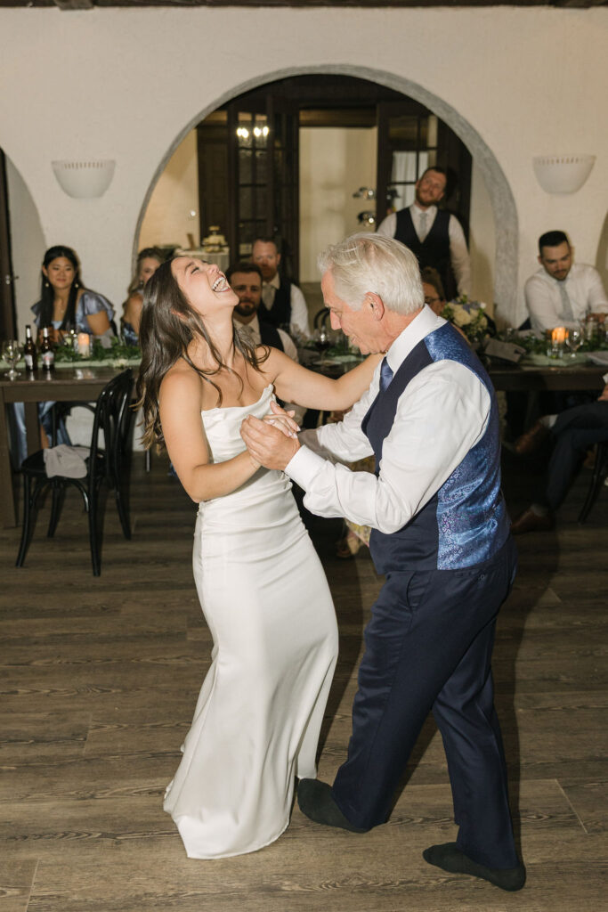 Bride dancing with dad during Colorado wedding reception.