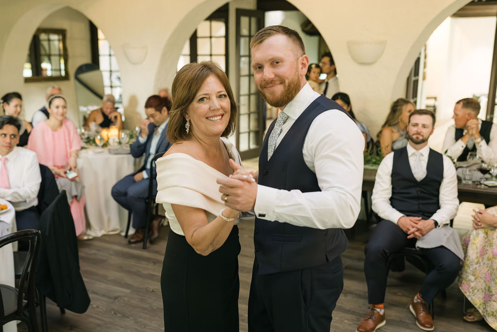 Groom dancing with mom at Villa Parker wedding.
