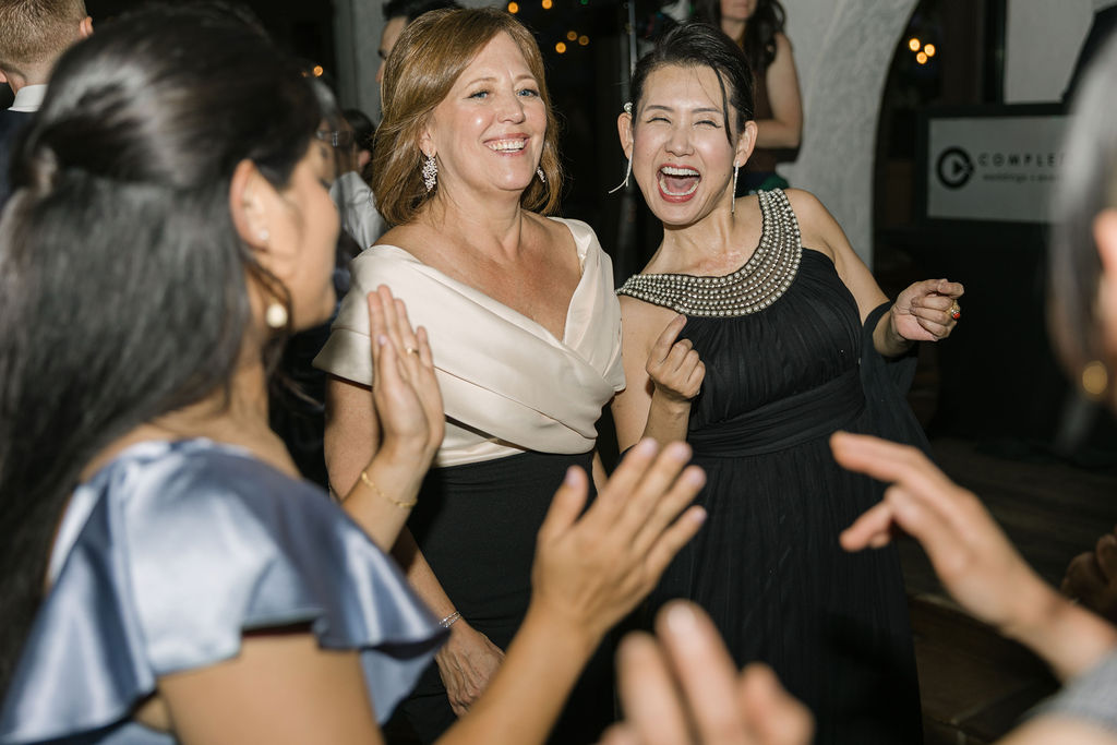 Guests laughing and dancing together during the Villa Parker wedding reception in Colorado.