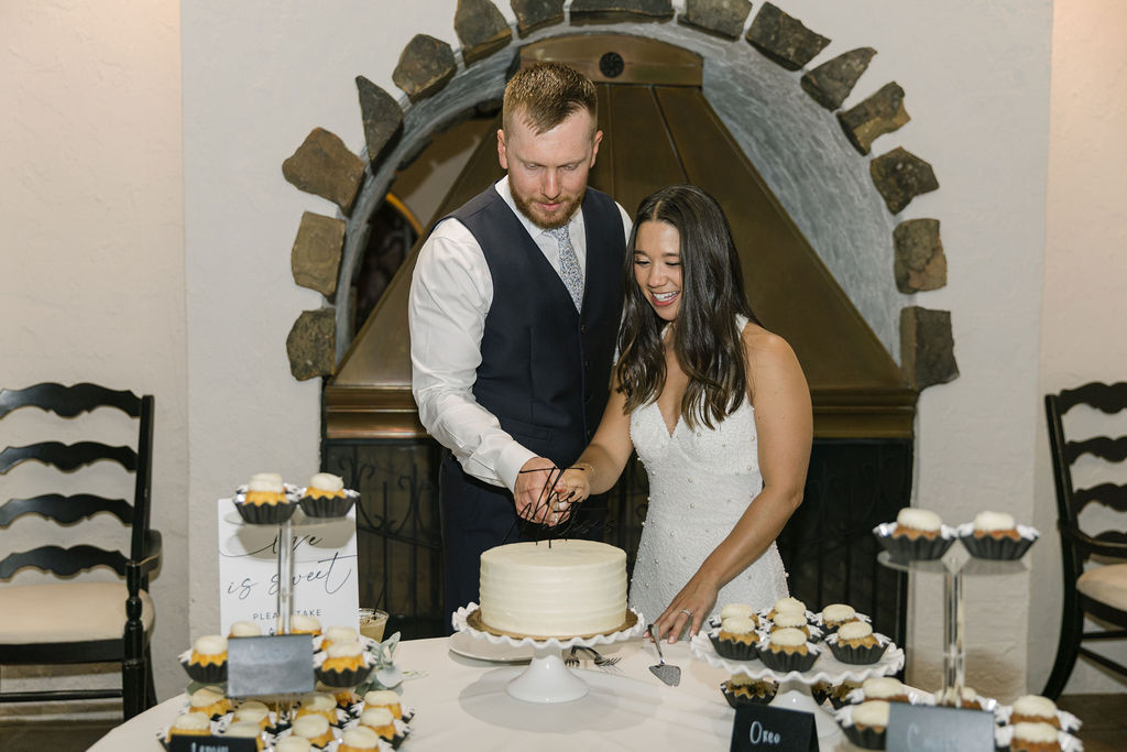 Bride and groom cutting cake during Villa Parker reception.