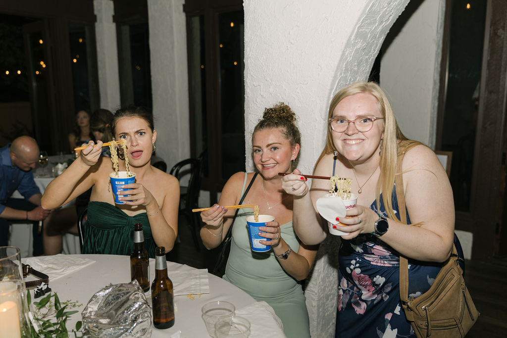 Guests enjoying a late night ramen bar and celebrating at a Villa Parker wedding reception.