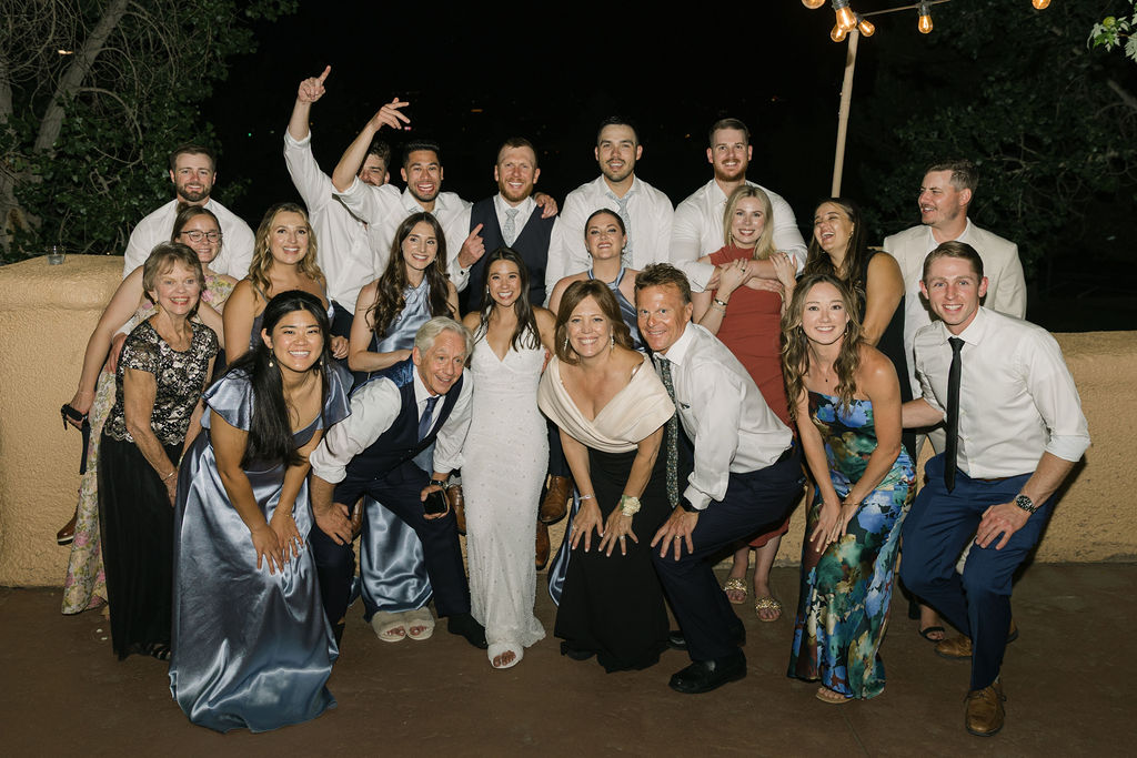 Large group of wedding guests posing for group photo at Villa Parker.