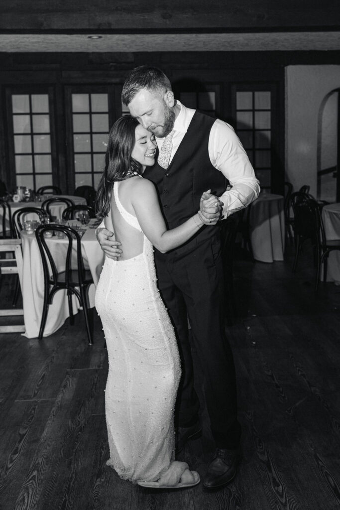 Bride and groom sharing private last dance inside Villa Parker reception room.