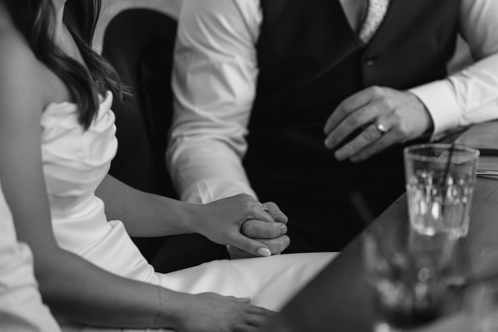 Bride and groom holding hands during their Villa Parker wedding reception.