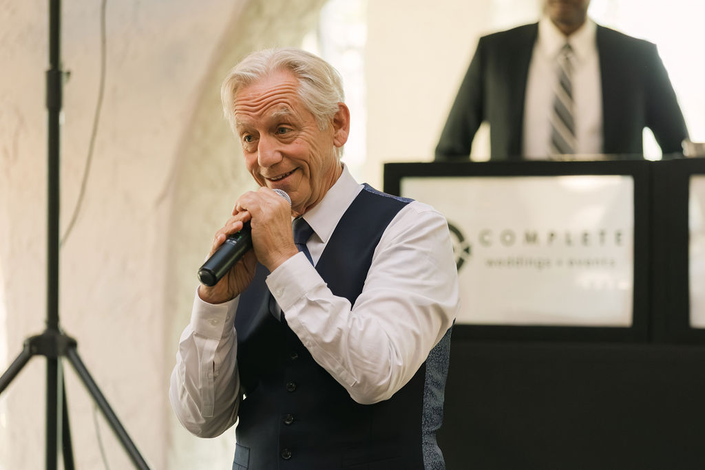Parent giving wedding speech at Villa Parker reception.