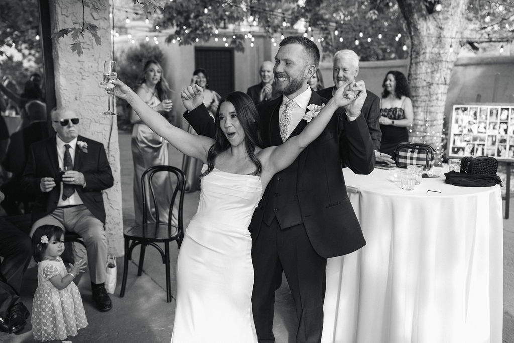 Bride and groom celebrating together during Villa Parker cocktail hour.