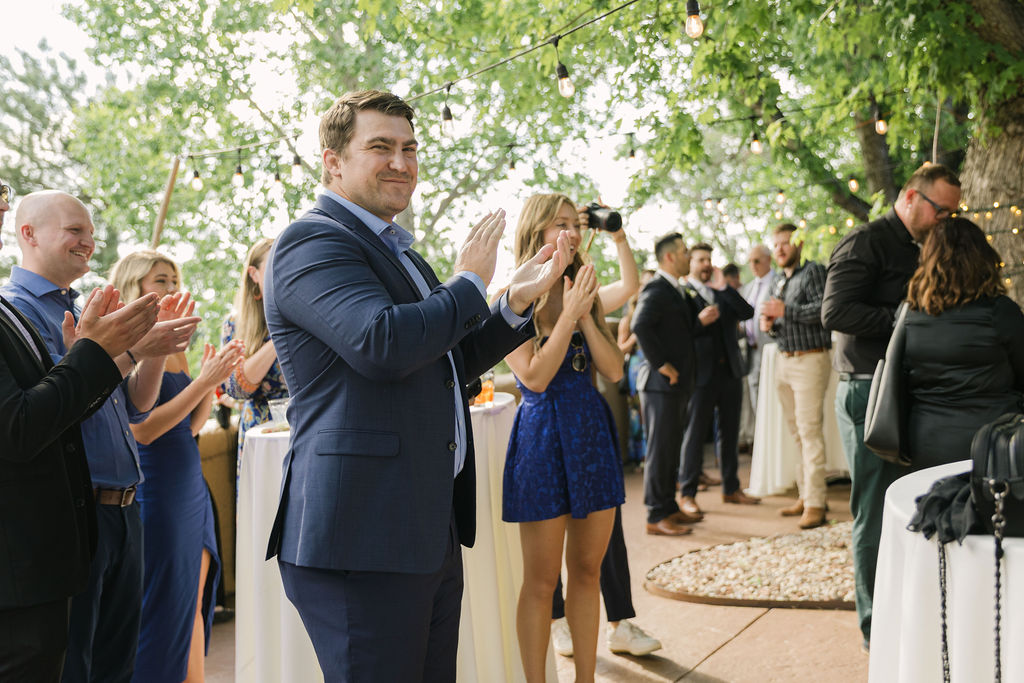 Guests clapping during cocktail hour at Villa Parker.