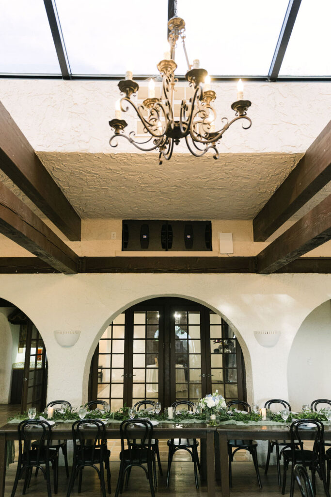Villa Parker reception room with chandelier and European-inspired architecture.