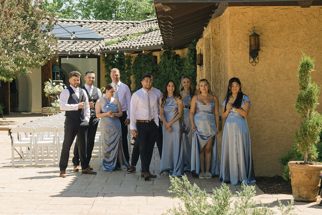 Bridal party lined up outside Villa Parker before Colorado wedding ceremony.