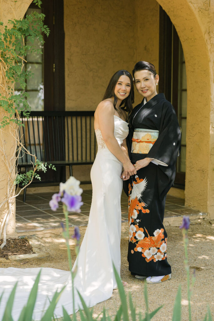 Bride with family member in kimono before ceremony at Colorado wedding.