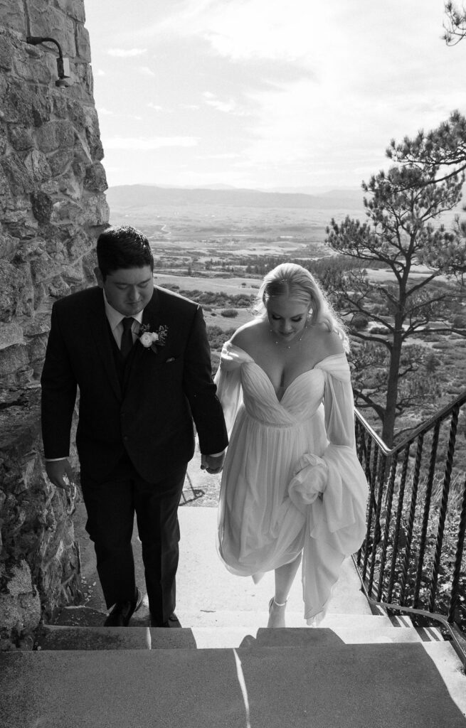 walking up the stairs at cherokee ranch and castle wedding