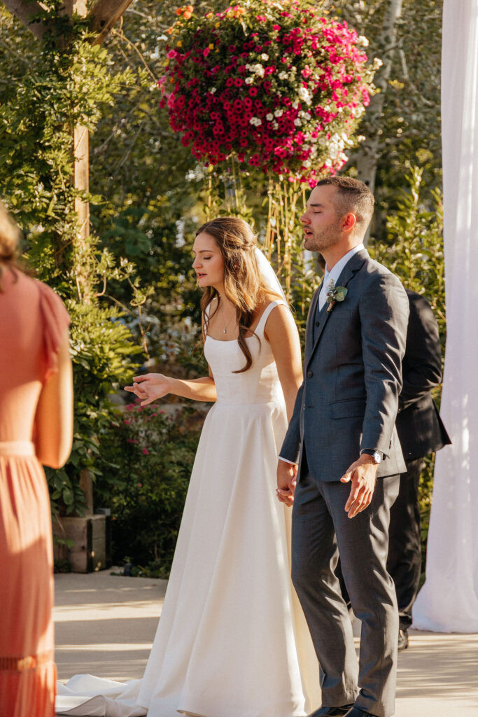 bride and groom during ceremony at Brookeside Gardens Event Center