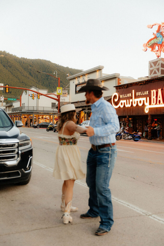 Vintage, western engagement photos at the Million Dollar Cowboy Bar in Jackson Hole