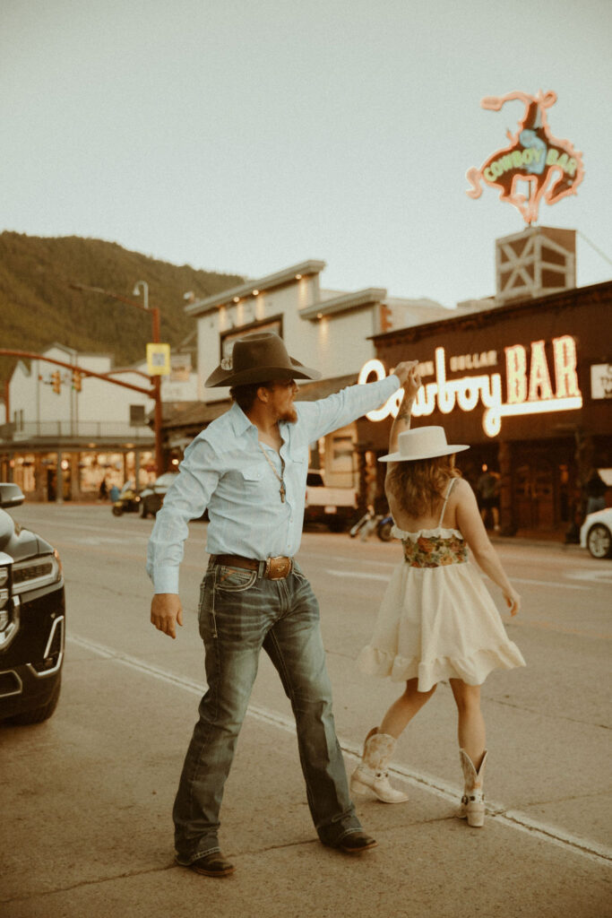 Vintage, western engagement photos at the Million Dollar Cowboy Bar in Jackson Hole