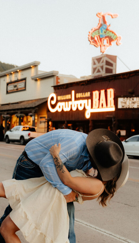 Vintage, western engagement photos at the Million Dollar Cowboy Bar in Jackson Hole