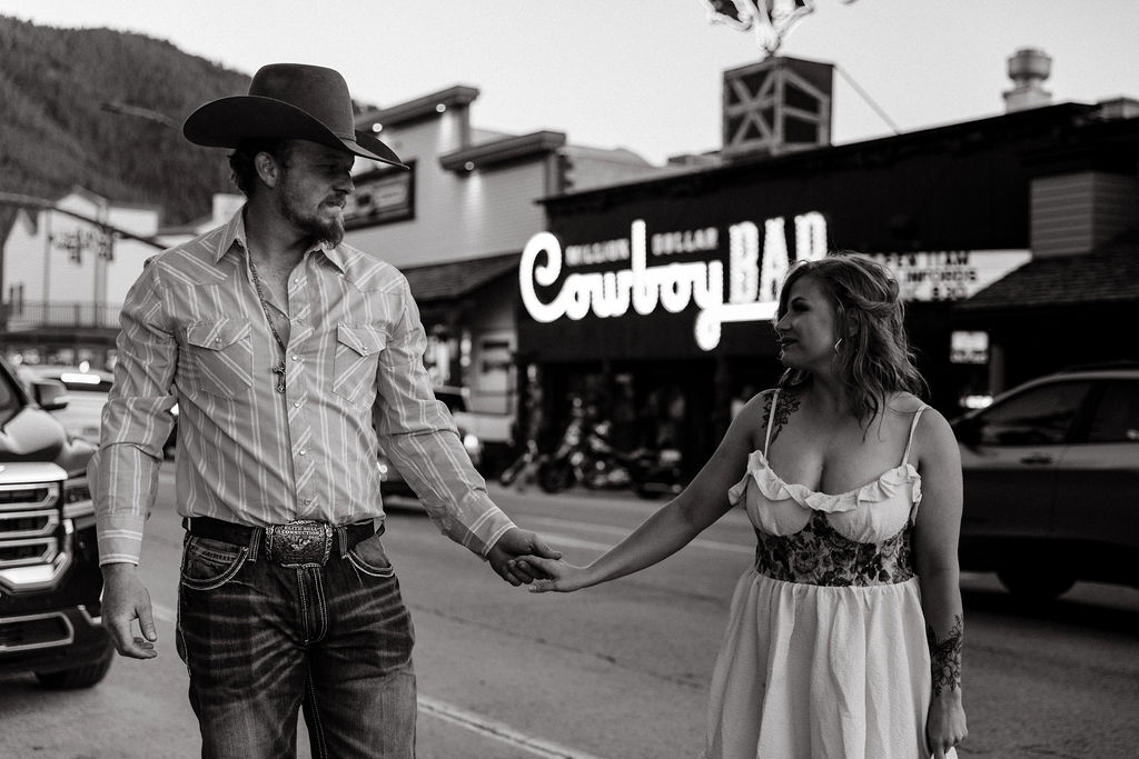 Vintage, western engagement photos at the Million Dollar Cowboy Bar in Jackson Hole