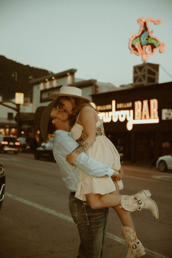 Vintage, western engagement photos at the Million Dollar Cowboy Bar in Jackson Hole