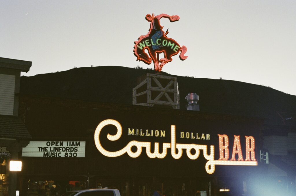 Vintage, western engagement photos at the Million Dollar Cowboy Bar in Jackson Hole