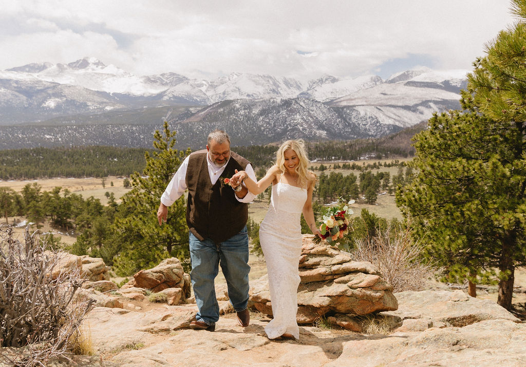 Estes Park wedding photos with red and white bouquet