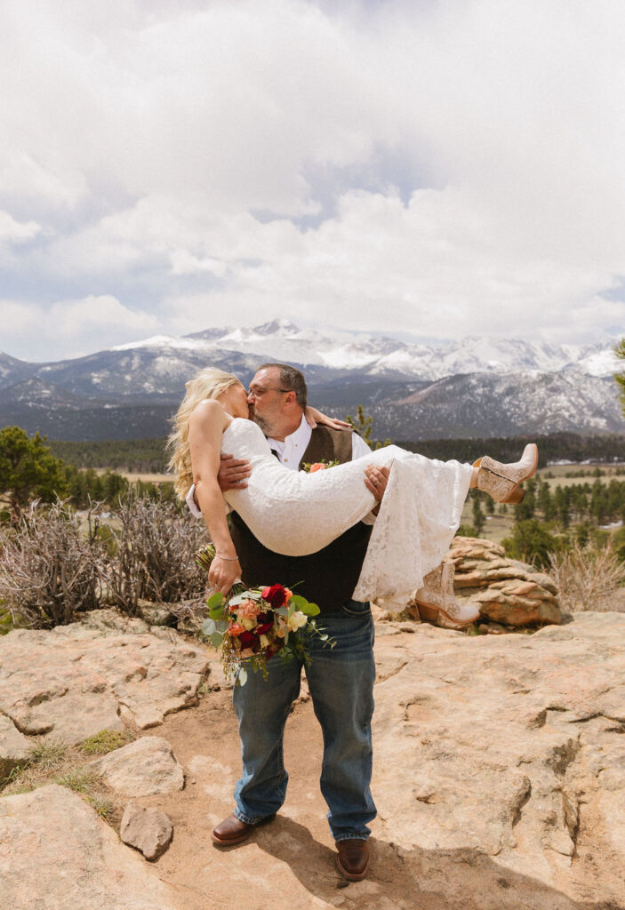 gorgeous rocky mountain elopement image of bride and groom kissing