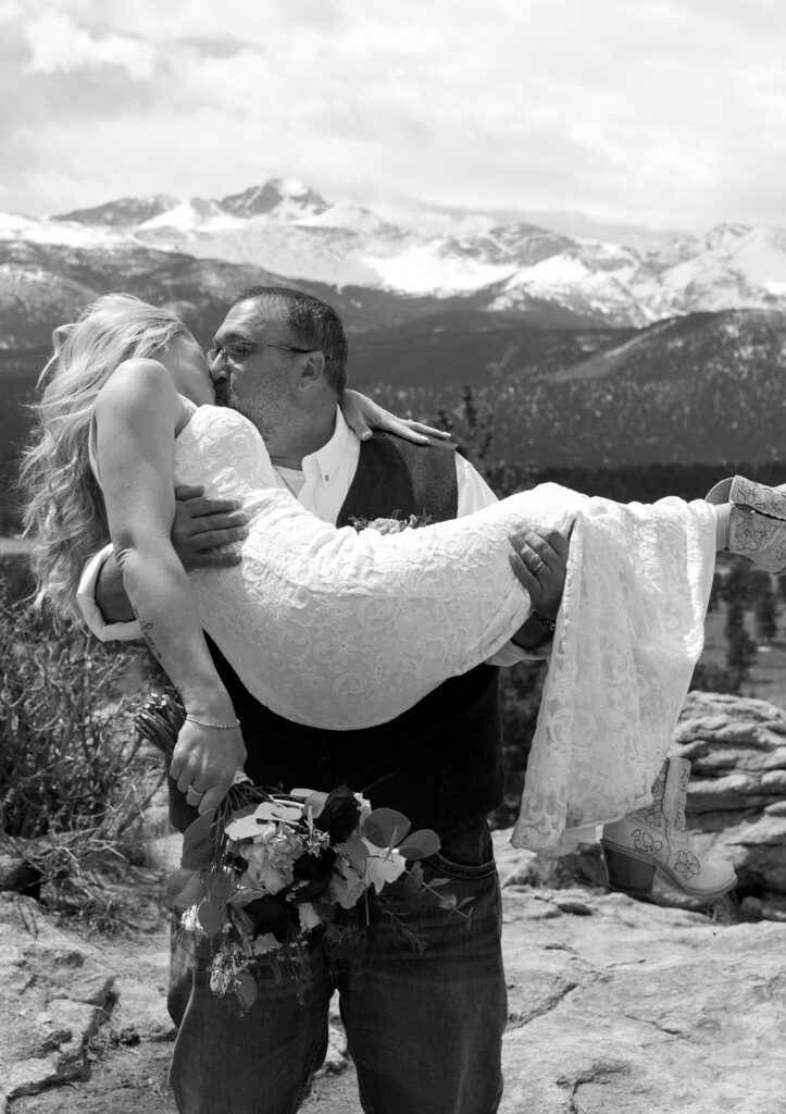 gorgeous rocky mountain elopement image of bride and groom kissing