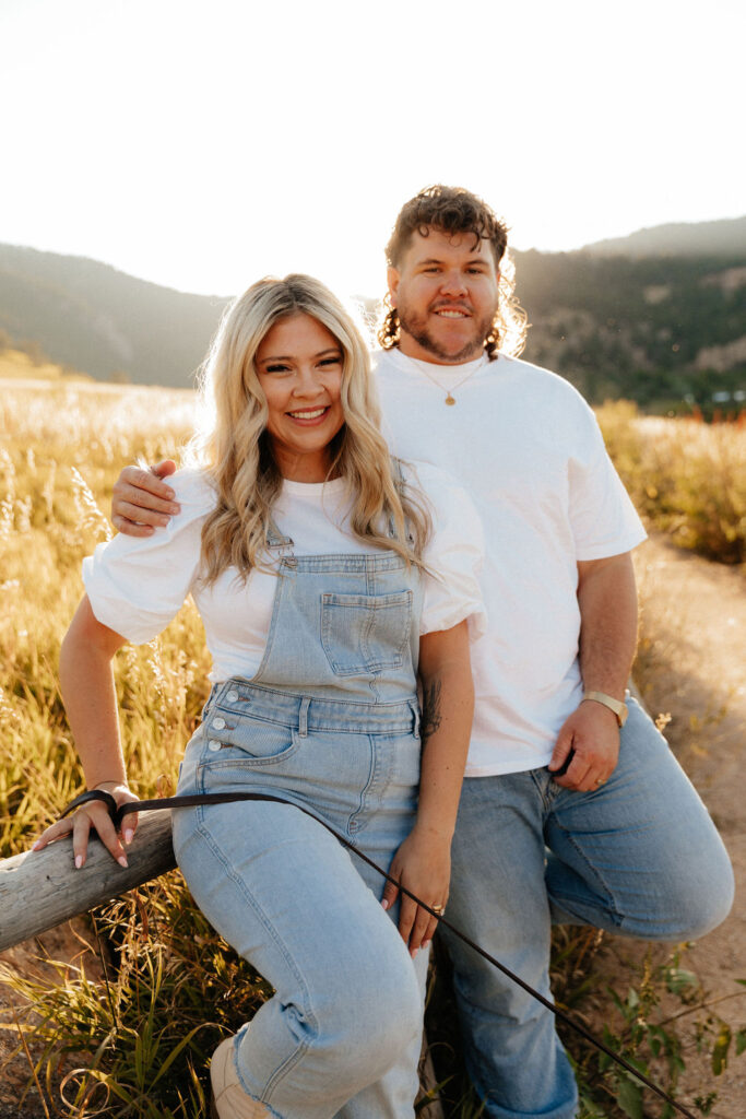 cute rustic engagement photos of a couple in white T shirts and jeans