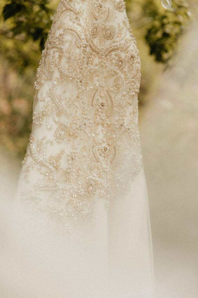 Wedding dress hanging from a tree at Stone Mountain Lodge