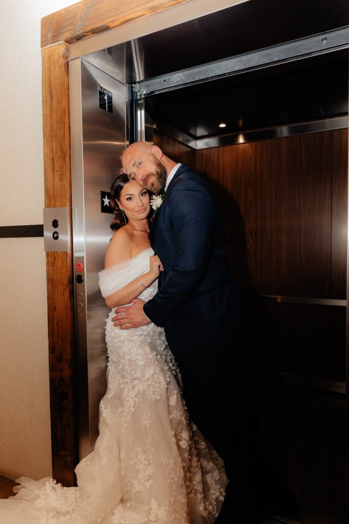 photo of bride and groom in elevator