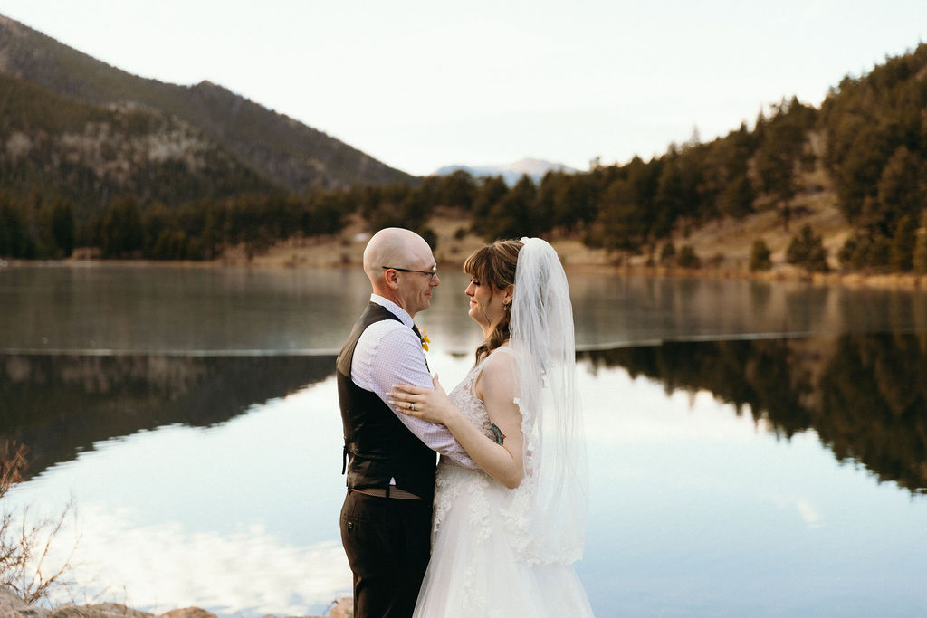 wedding photos by a mountainside lake 