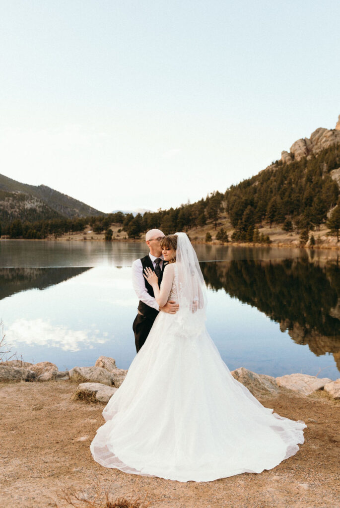 wedding photos by a mountainside lake 