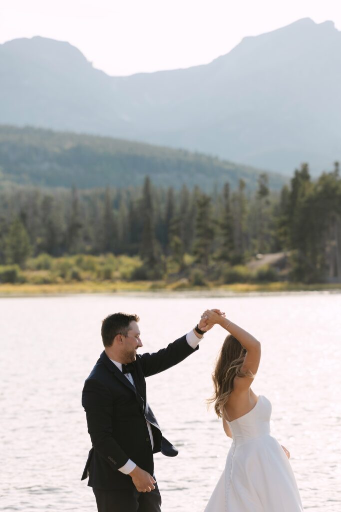 Couple dancing at Sprague Lake during their Colorado micro wedding in Rocky Mountain National Park