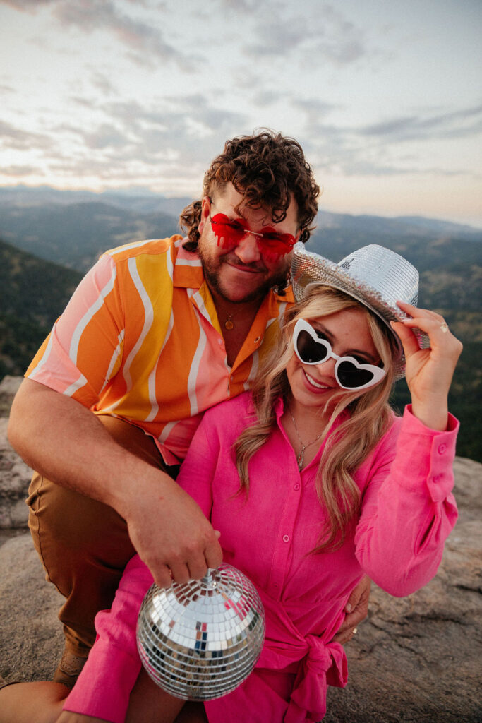 retro vibe lost gulch overlook engagement photos with fun outfits, disco ball and a disco cowboy hat