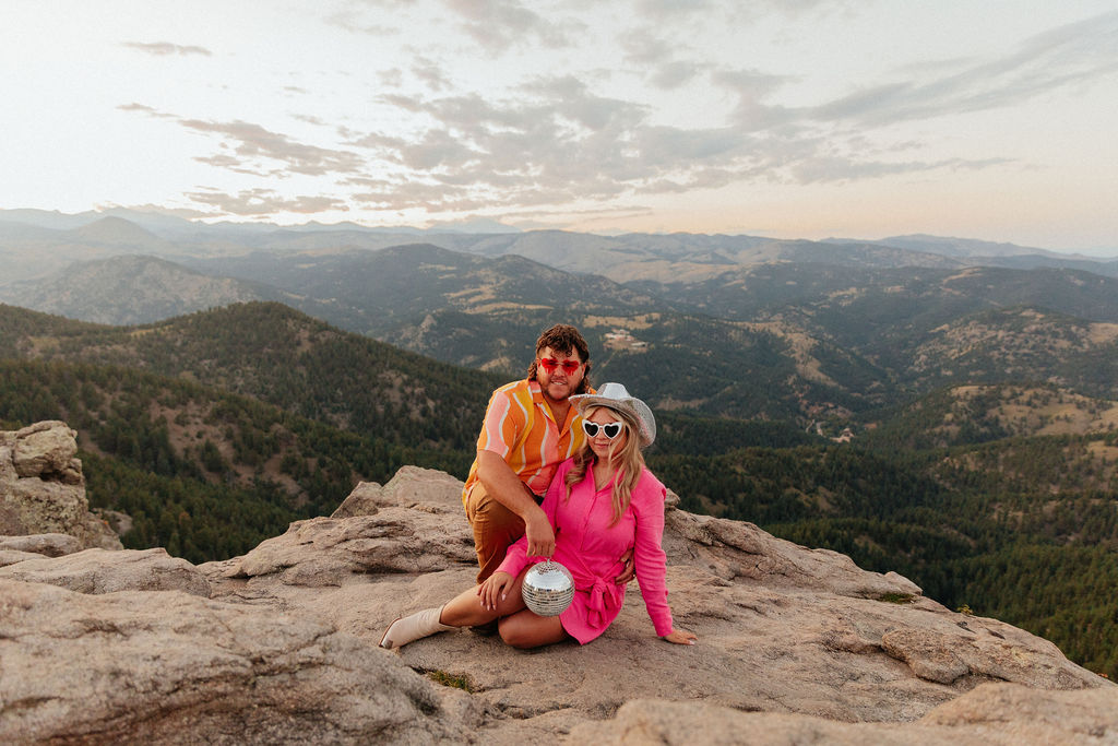 retro vibe lost gulch overlook engagement photos with fun outfits, disco ball and a disco cowboy hat