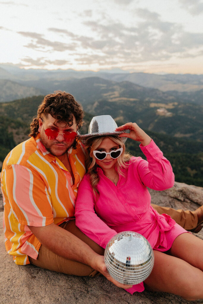 retro vibe lost gulch overlook engagement photos with fun outfits, disco ball and a disco cowboy hat