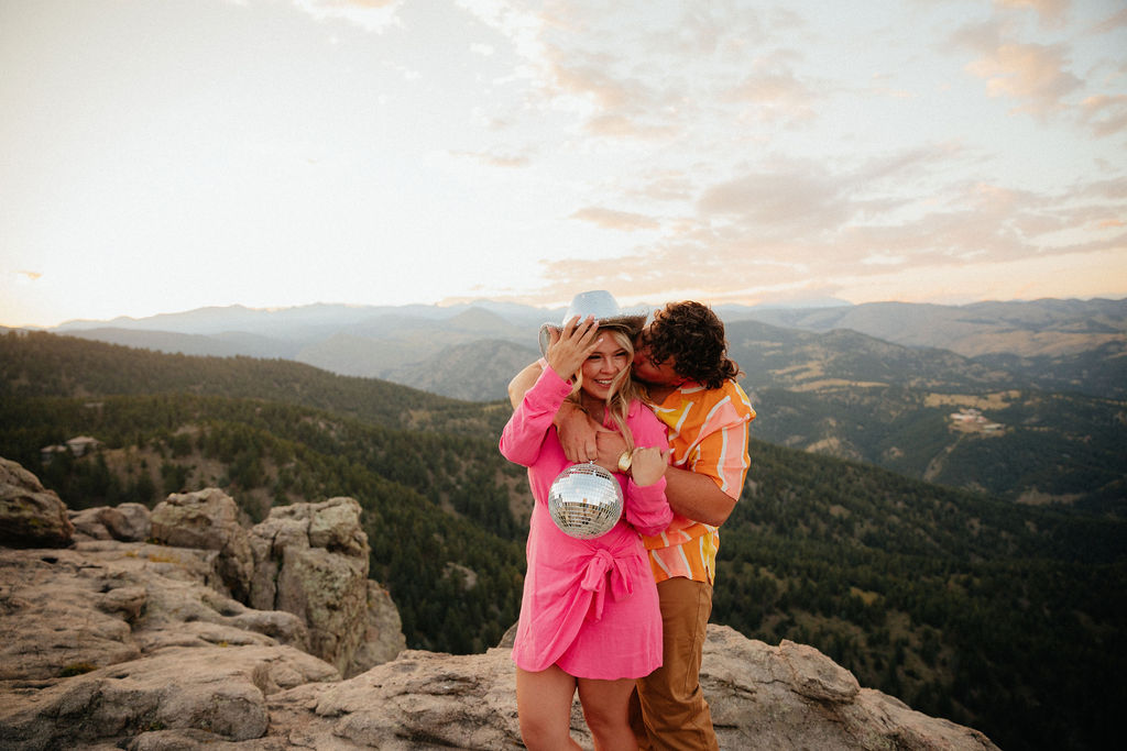 retro vibe lost gulch overlook engagement photos with fun outfits, disco ball and a disco cowboy hat