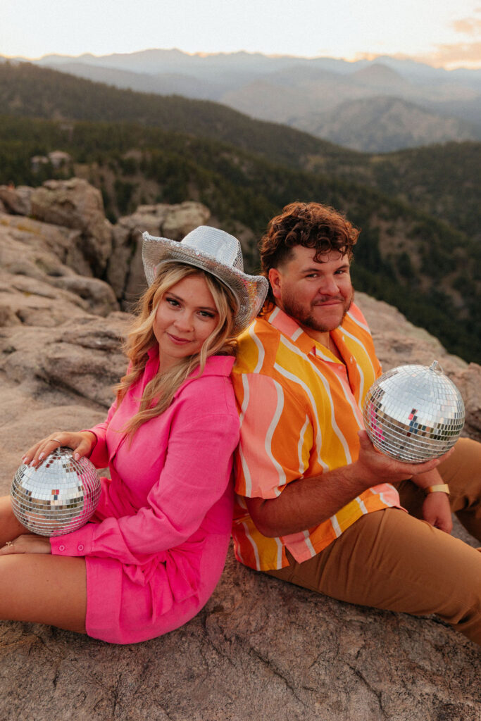 retro vibe lost gulch overlook engagement photos with fun outfits, disco ball and a disco cowboy hat