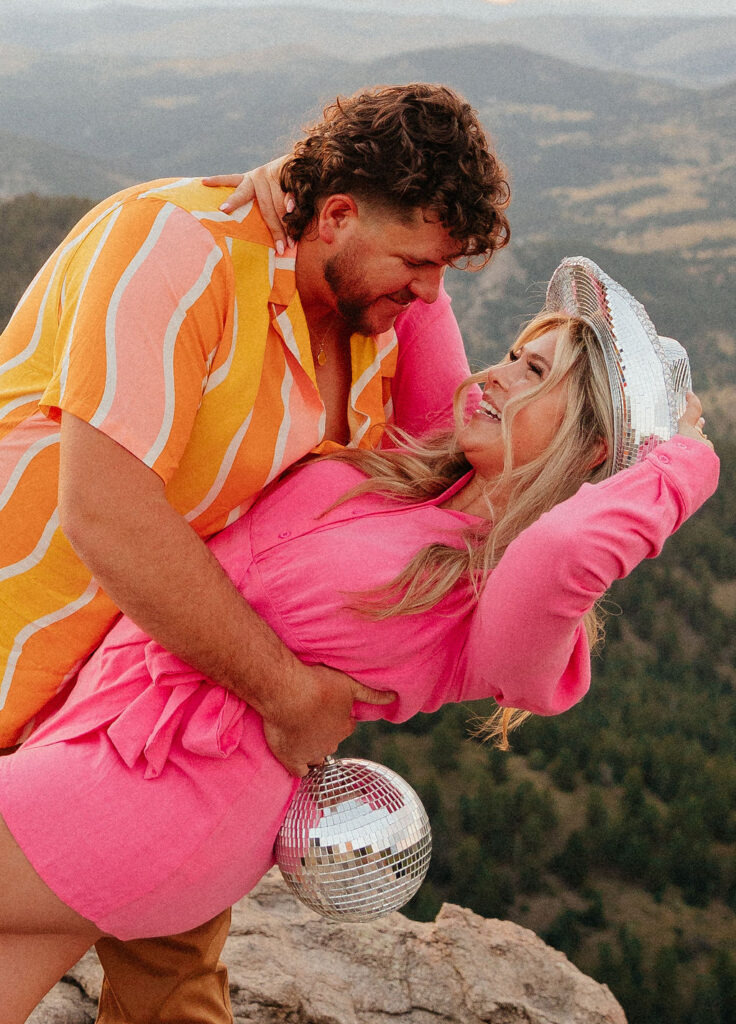 retro vibe lost gulch overlook engagement photos with fun outfits, disco ball and a disco cowboy hat