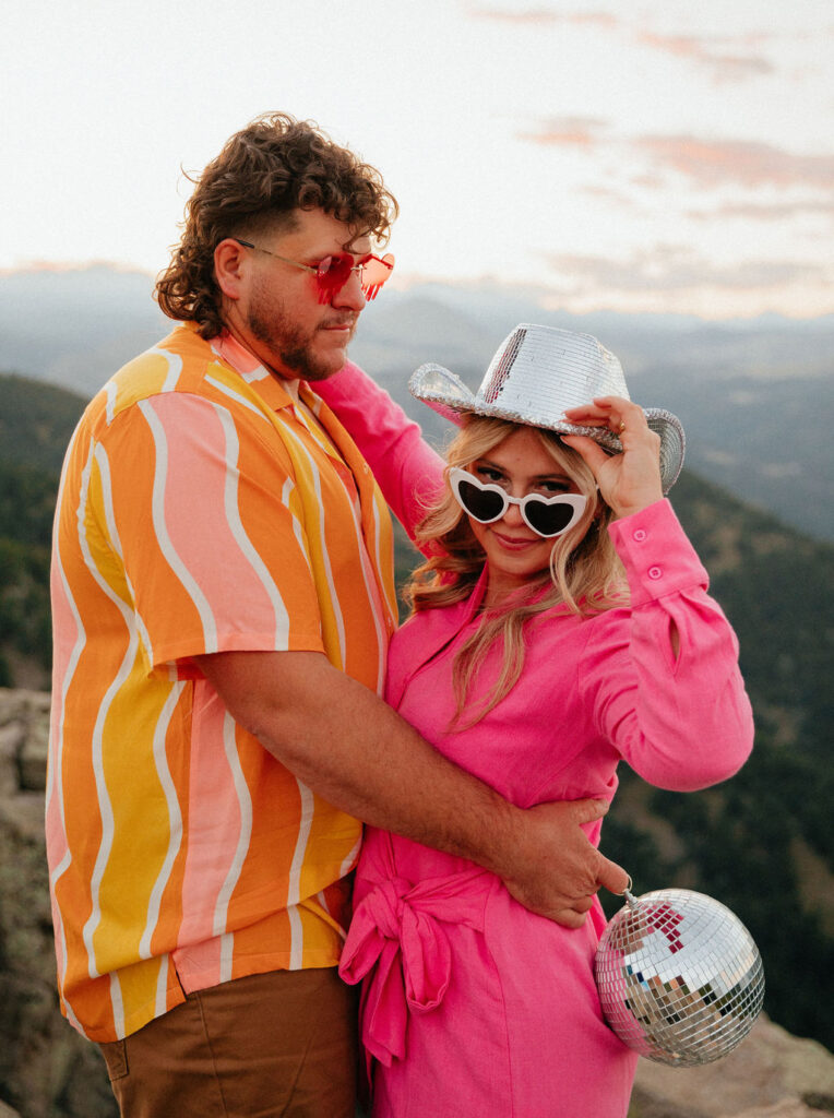 retro vibe lost gulch overlook engagement photos with fun outfits, disco ball and a disco cowboy hat