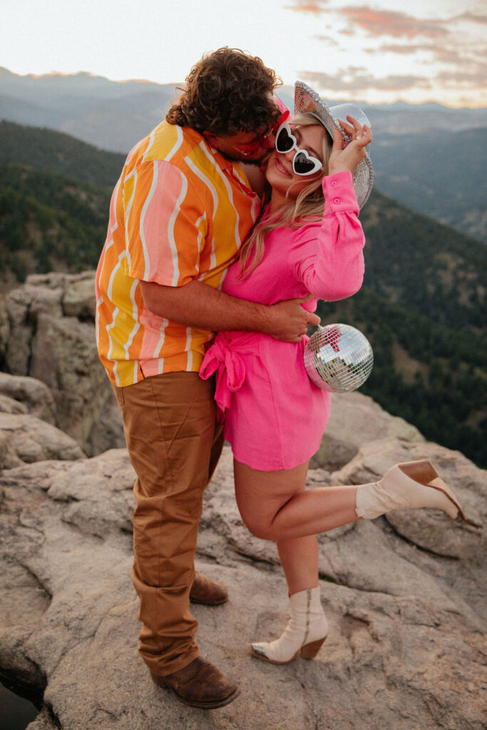 retro vibe lost gulch overlook engagement photos with fun outfits, disco ball and a disco cowboy hat