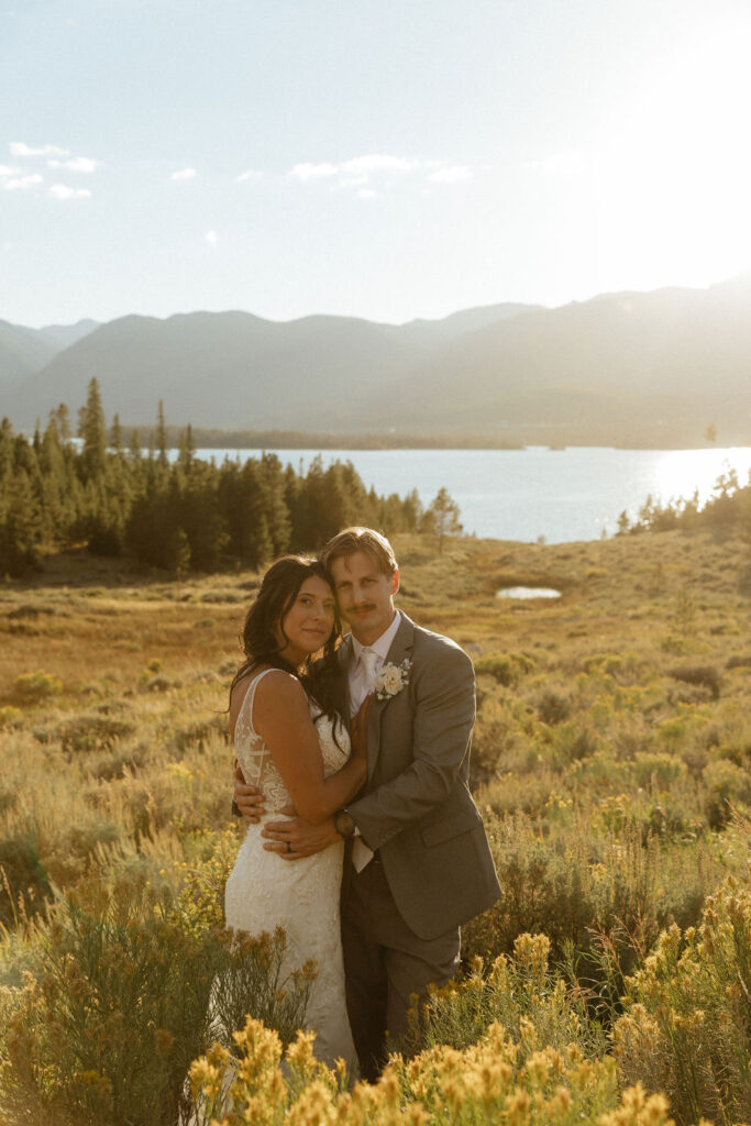 bride and groom in a wildflower field in colorado during their windy point campground wedding