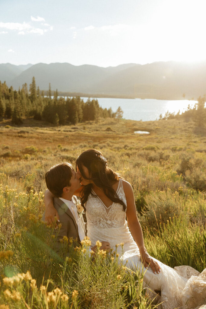 bride and groom in a wildflower field in colorado during their windy point campground wedding