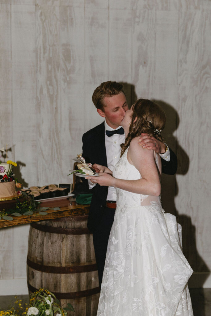 bride and groom cutting cake