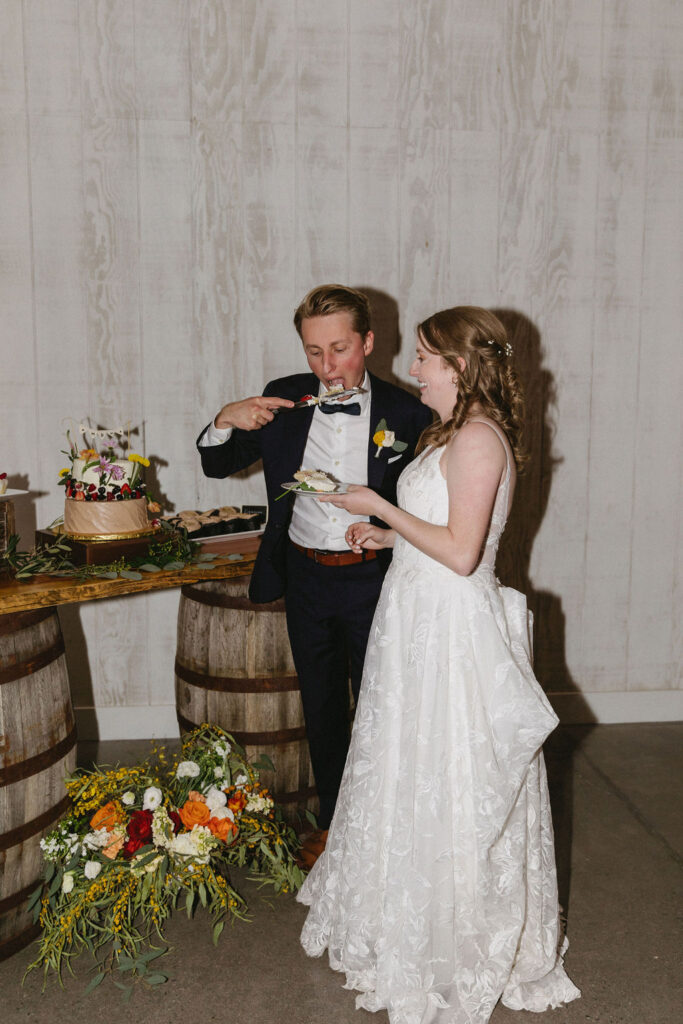 bride and groom cutting cake