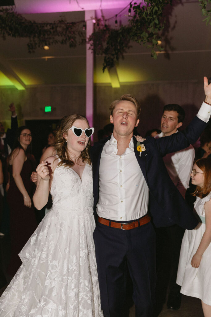 bride and groom dancing and having fun at their wedding reception