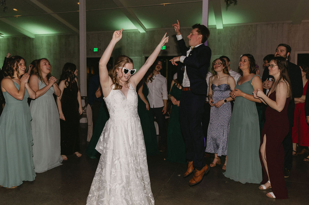 bride and groom dancing and having fun at their wedding reception