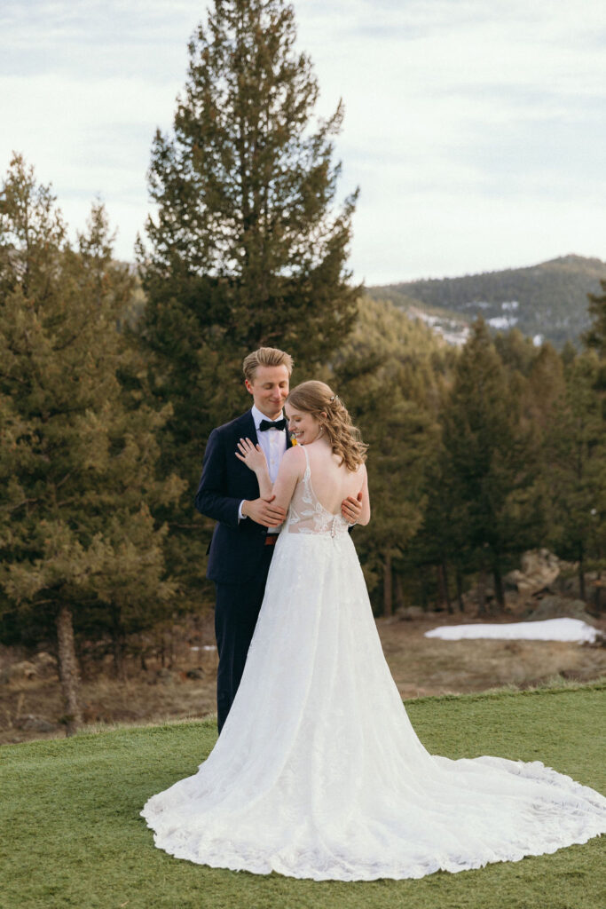 romantic bride and groom portrait in the backyard of Woodland Wedding Venue, CO