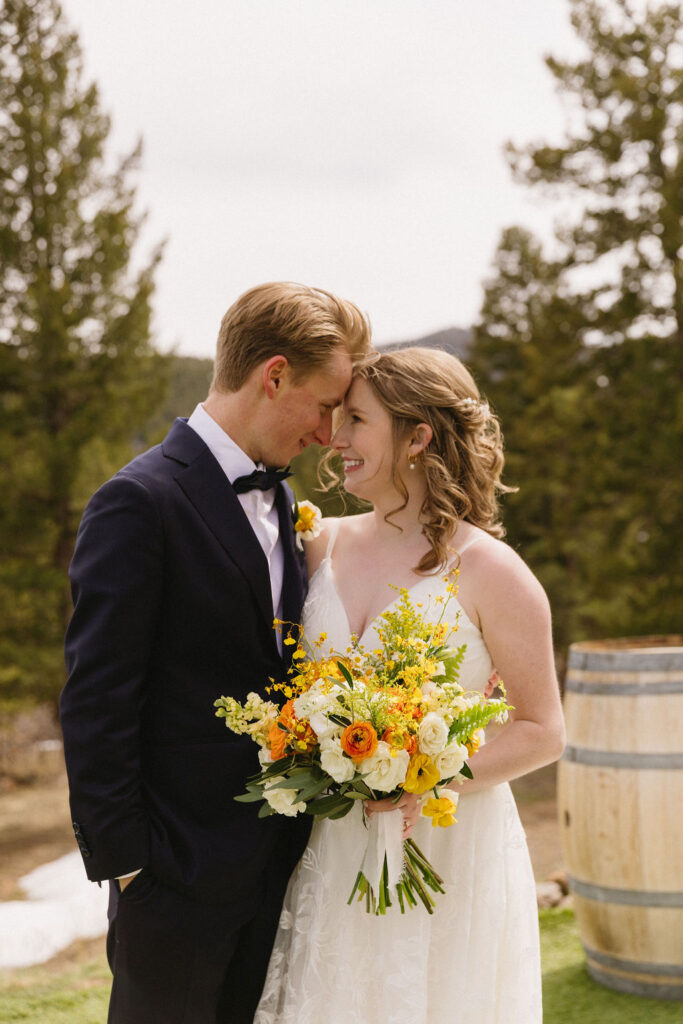 romantic bride and groom portrait in the backyard of Woodland Wedding Venue, CO