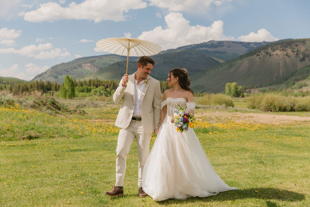 Camp Hale wedding venue photos of bride and groom with wildflowers 